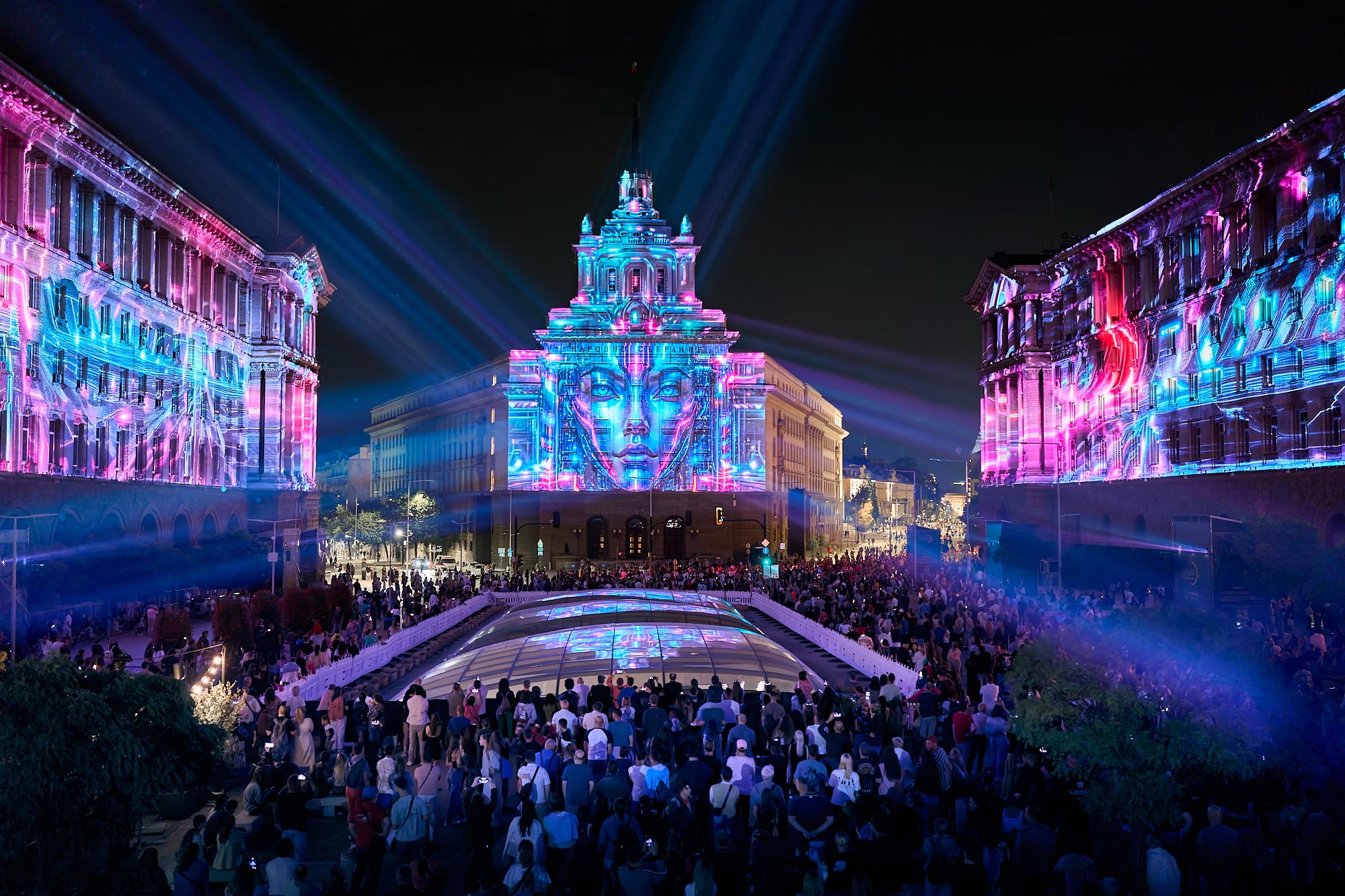 Wide view of blue and pink projections across the Largo and audience at LUNAR 2026, Sofia